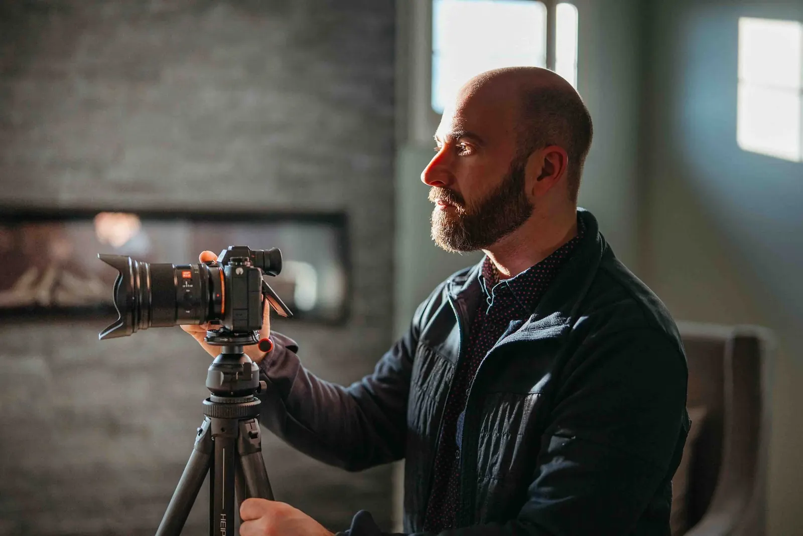Dan operating a cinema camera on a tripod