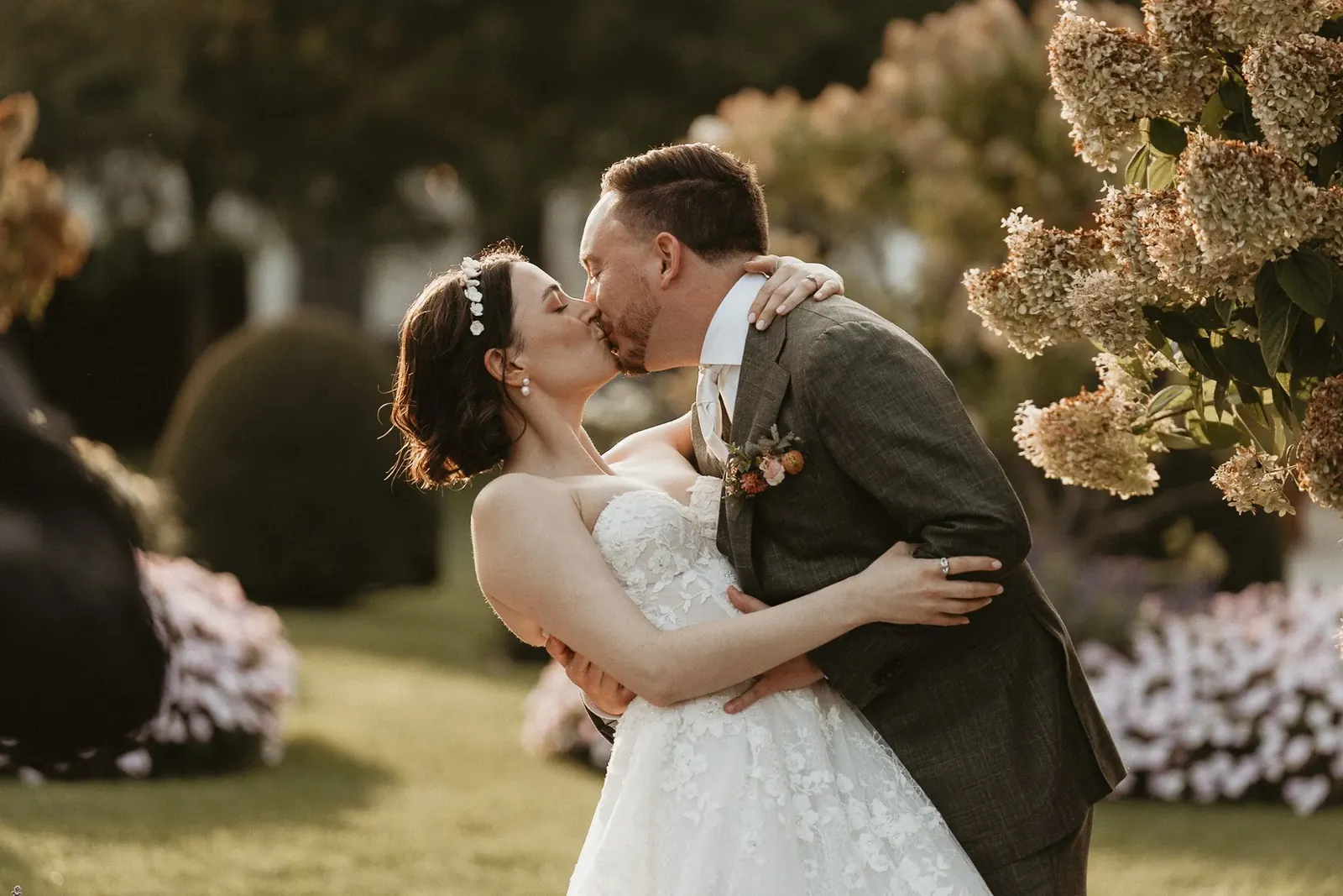 A couple embracing among autumn flowers